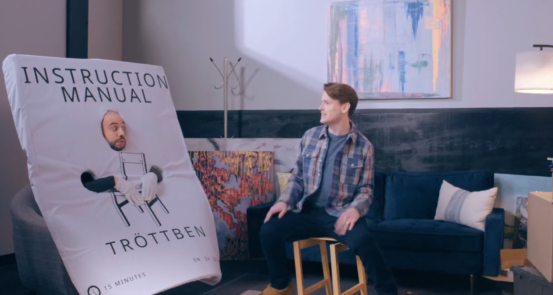 man speaking to instruction manual